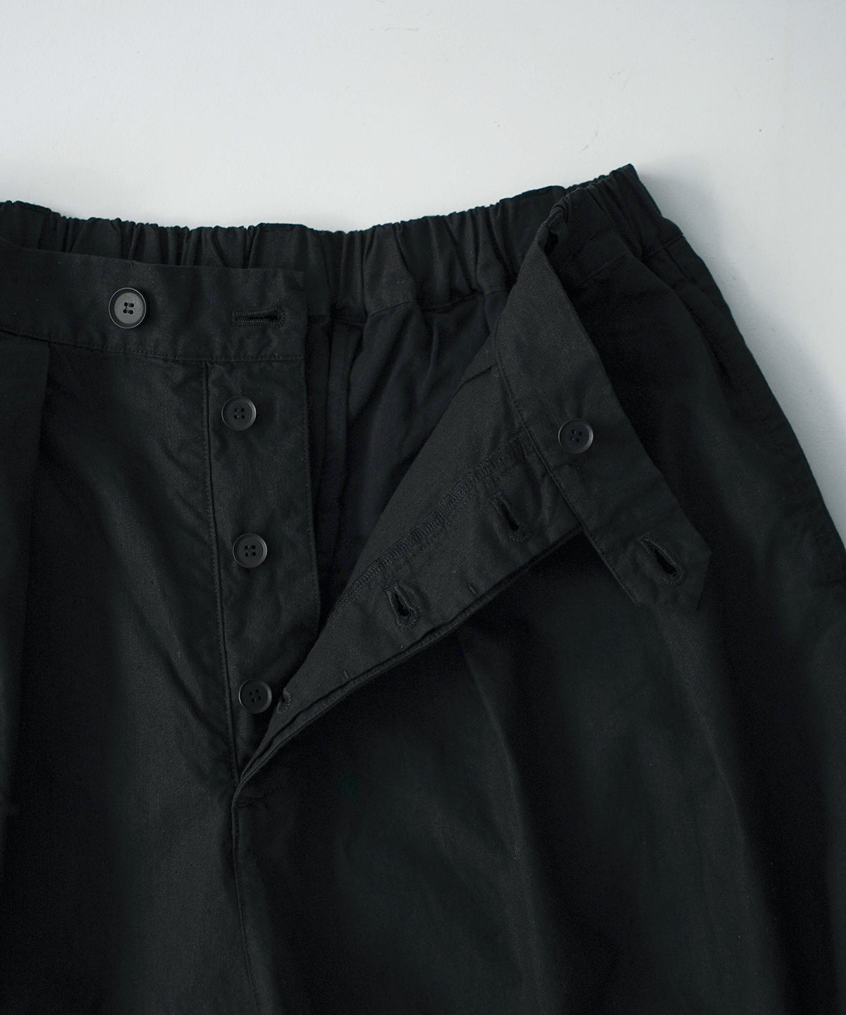 Offset Button Pleated Trousers